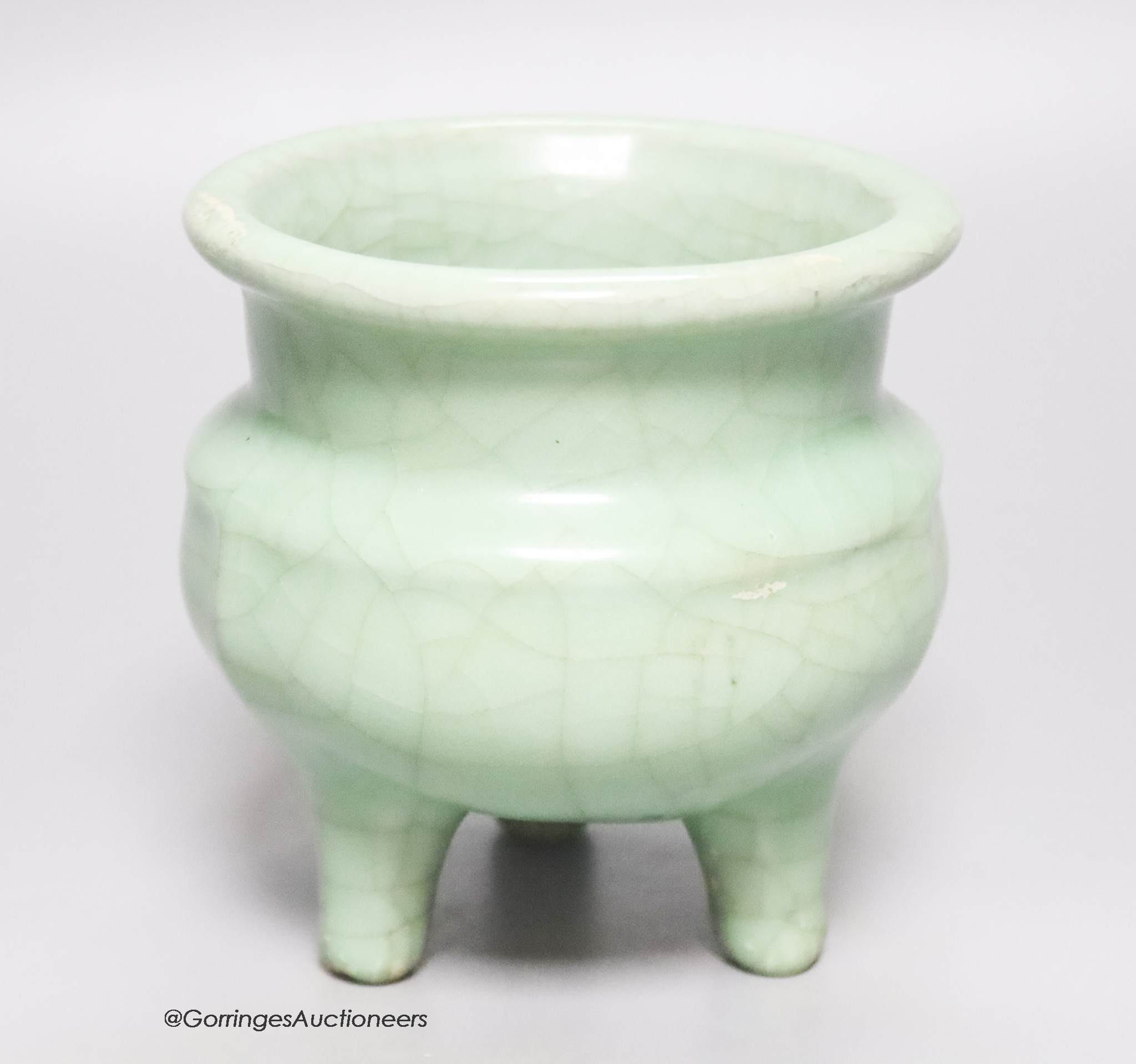 A Chinese green crackle glazed tripod censer, height 12cm